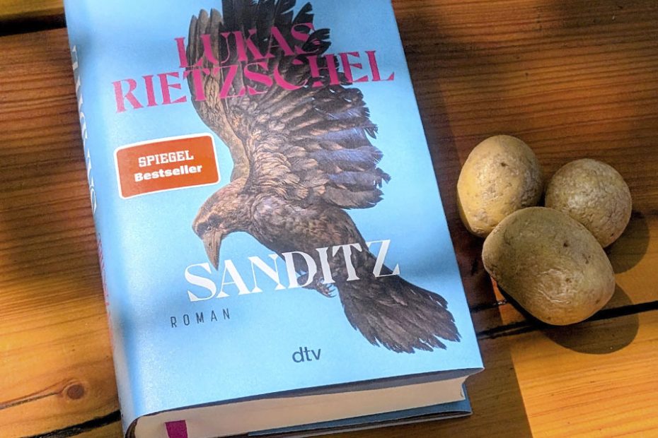 Buchcover "Sanditz" und Kartoffeln zur Lesung am 4. Juni im Hinterland Hostel